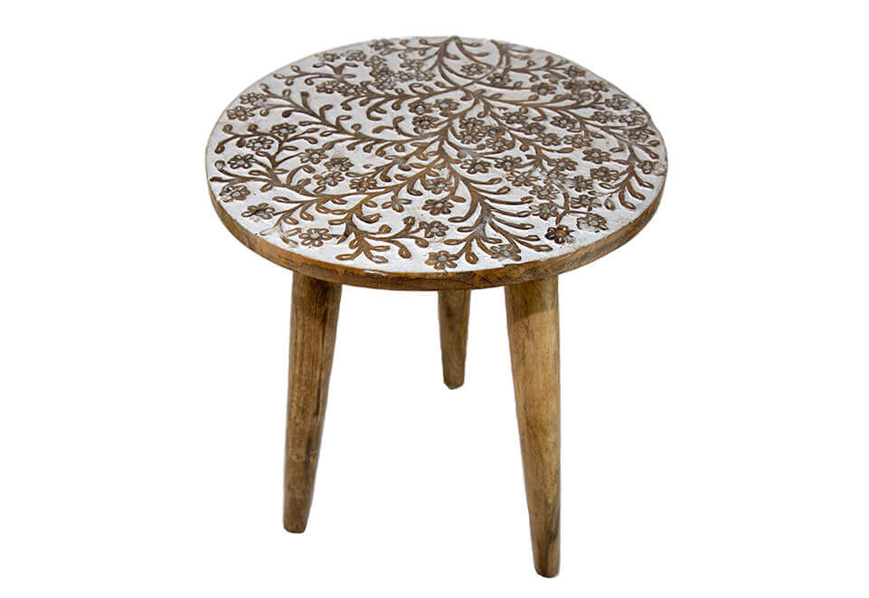 Short side table with hand carved leaf and flower designs.