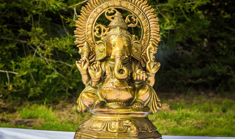 brass ganesha statue used in indian wedding