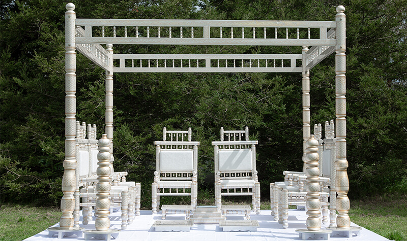 gold and white mandap setting for an indian wedding
