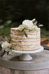 Floral ceremony backdrop at a Hindu wedding in California, featuring lush white flowers and greenery styled for a traditional outdoor wedding celebration