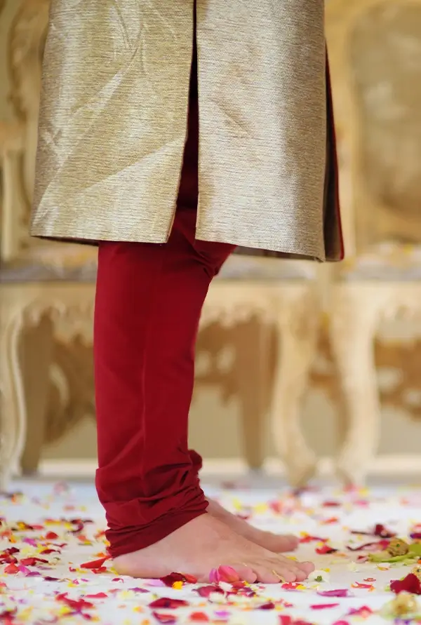 traditional indian wedding ceremony details featuring embroidered bridal lehenga bangles and rose garland cultural wedding decor california wine country