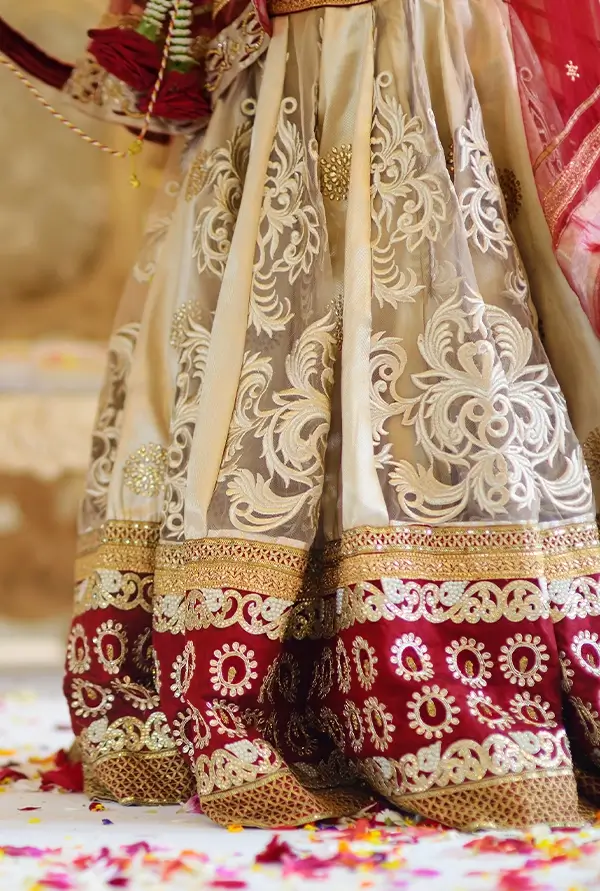 traditional indian wedding ceremony details featuring embroidered bridal lehenga bangles and rose garland cultural wedding decor california wine country
