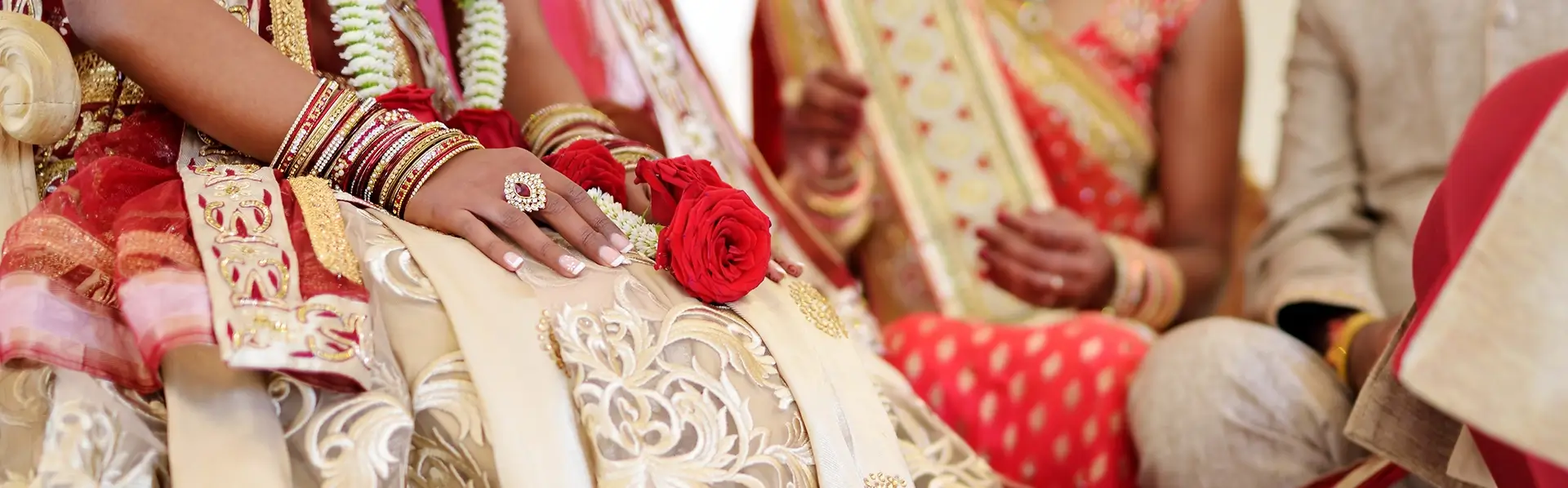 traditional indian wedding ceremony details featuring embroidered bridal lehenga bangles and rose garland cultural wedding decor california wine country