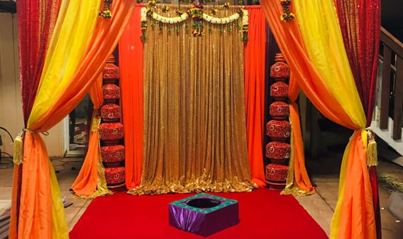 orange and red colored mandap for indian wedding